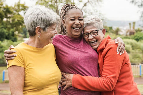 three women have fun together turning health around