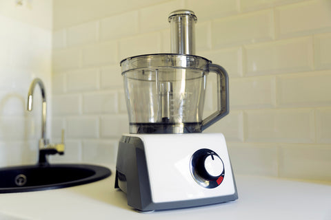 Electric food processor on kitchen countertop