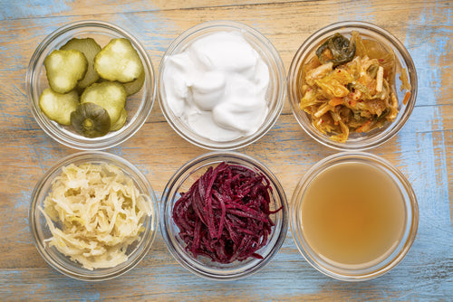 serving bowls with various fermented foods