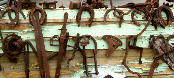 Rusty tools and horse shoes