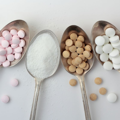 Different forms of zinc supplements: tablets, capsules, and powder.
