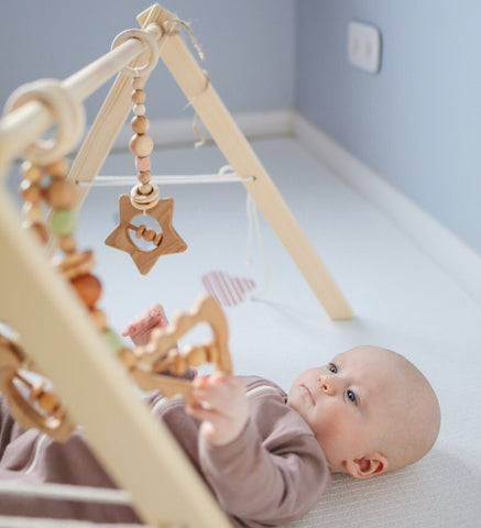 Use wooden toys and décor to create an eco-friendly nursery for your baby
