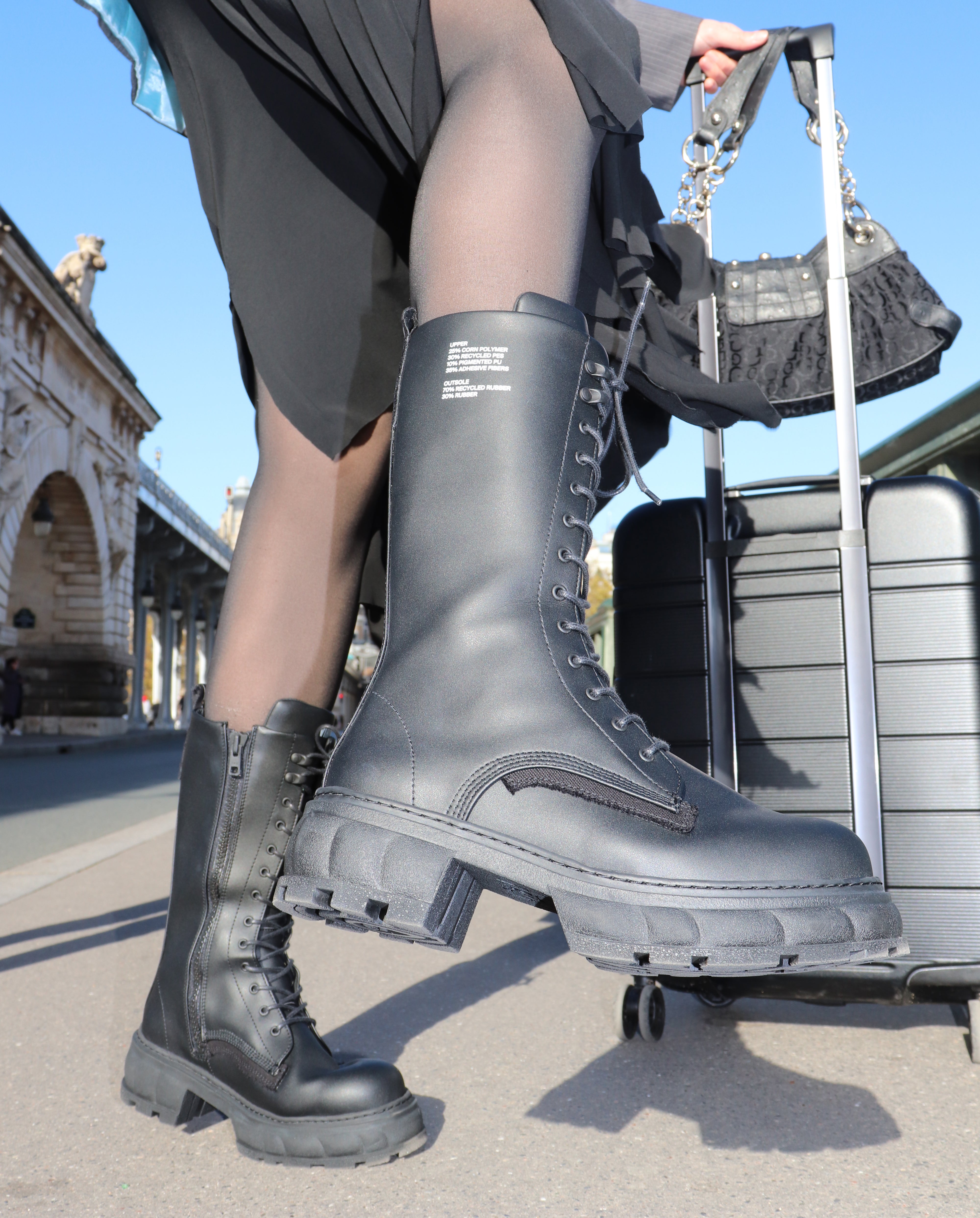 Girl wearing a high top vegan boot