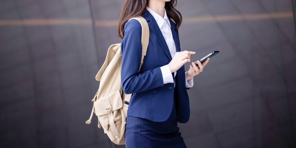 Is it rude for a woman to wear a backpack with a suit?