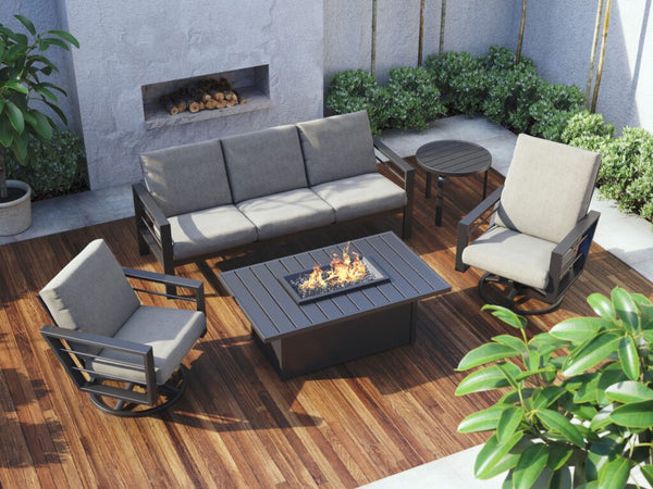 A quality, built-to-last Sutton Cushion three-piece outdoor patio furniture set positioned around a fire table