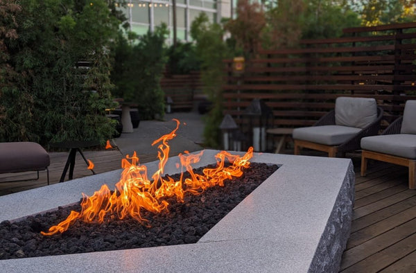 Wicker outdoor furniture surrounded by plants