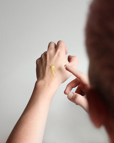 Hands applying 'Just Hand Stuff' all natural and vegan hand balm