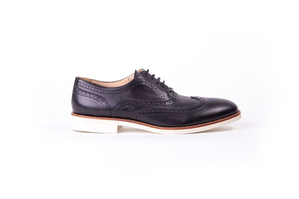 wingtip shoes with white soles