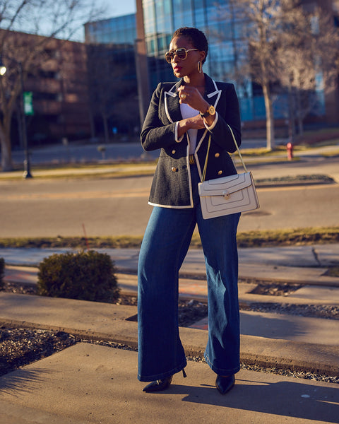 Farotelle wearing Gap blue jeans with black Express Blazer, black Sam Edelman pumps, white bag as Elevated Casual Style Spring Summer Work Outfit.