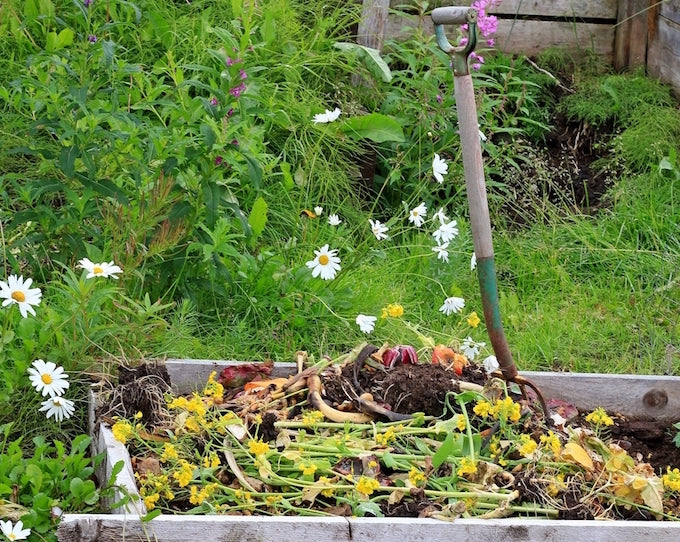 Full compost bin in garden