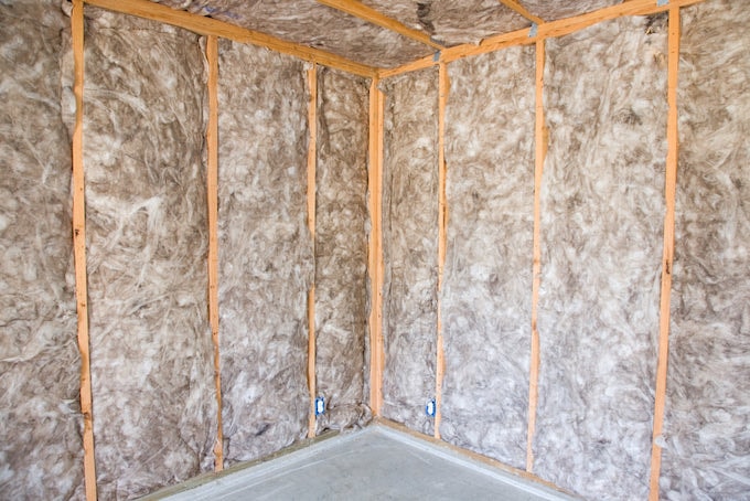 Interior wall insulation on building site