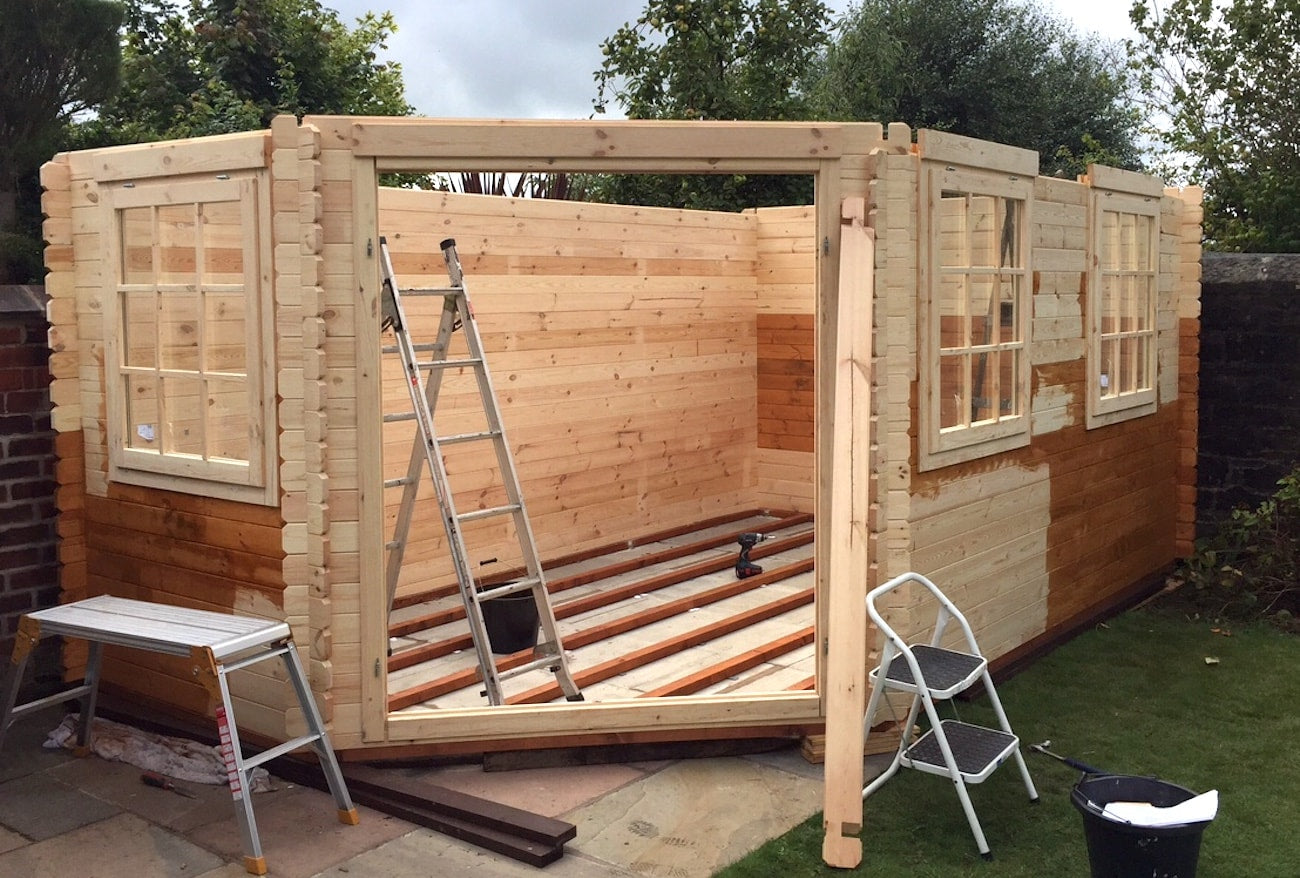 Building a log cabin in garden