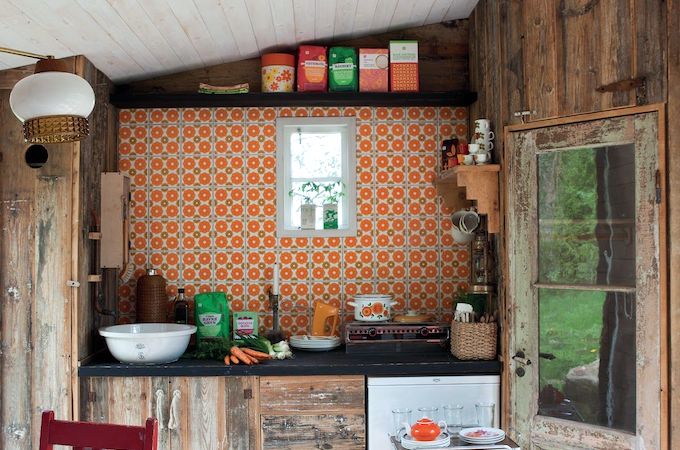 Retro shed interior with patterned wallpaper
