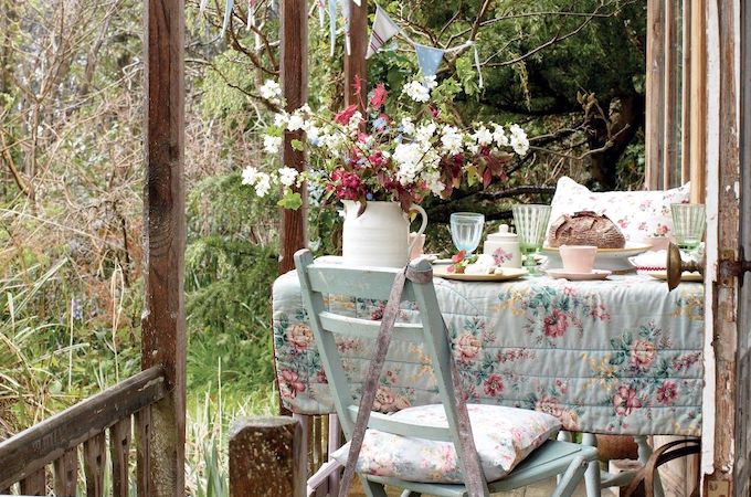 Vintage shed exterior with table and chairs