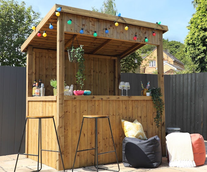 Wooden garden bar from Waltons with multicoloured fairylights 