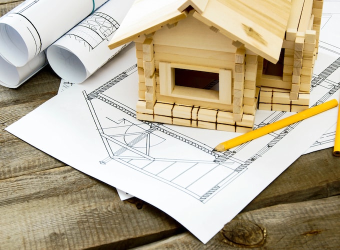 Mini wooden model with a home building diagram