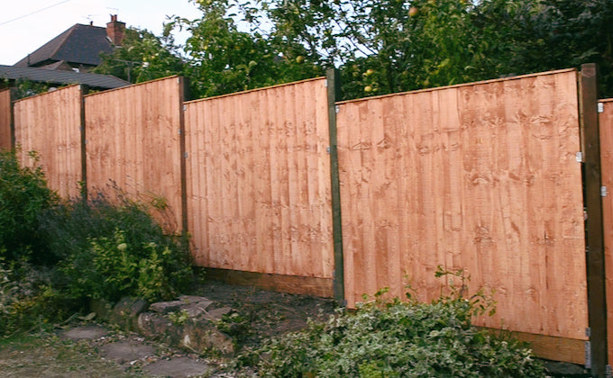 finished fence with wood preserve