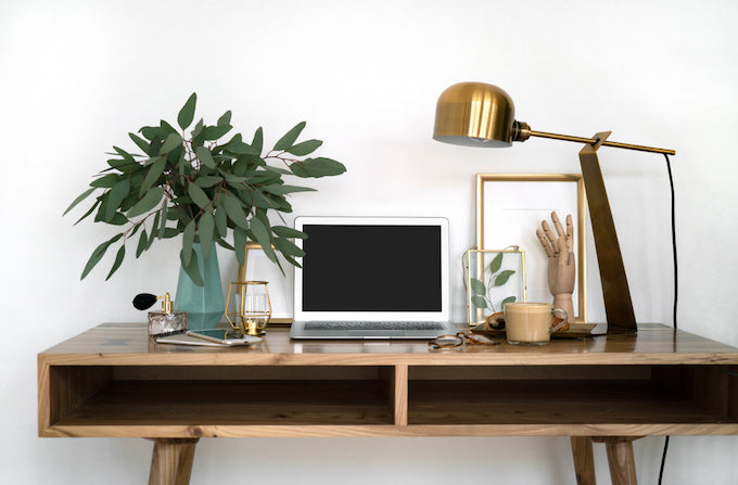 Office interior with a desk and greenery