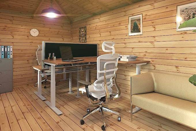 Interior of a log cabin turned into a home office with computer, desk and computer chair