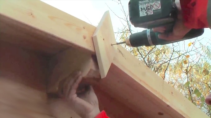 Installing finial and fascia log cabin