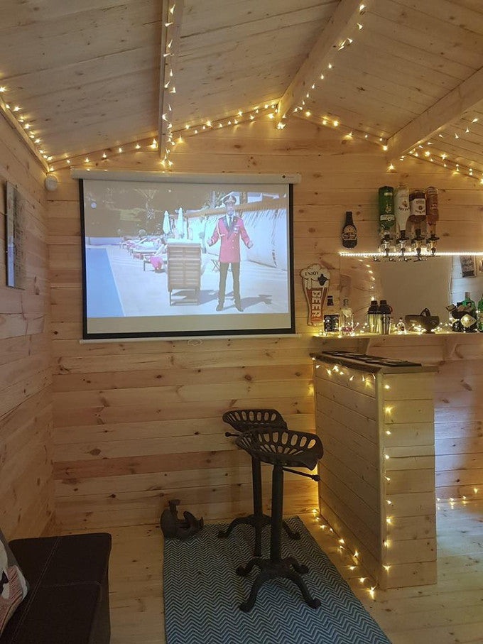 Projector screen in log cabin bar