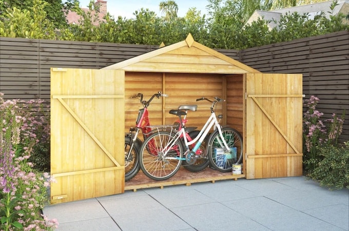 Double door wooden bike shed from Waltons with two bikes