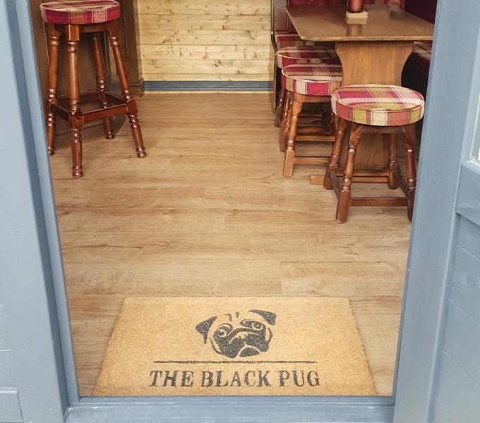 Laminate flooring in The Black Pug log cabin