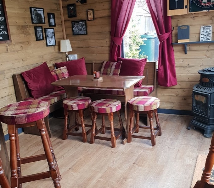 Seating view in The Black Pug log cabin pub