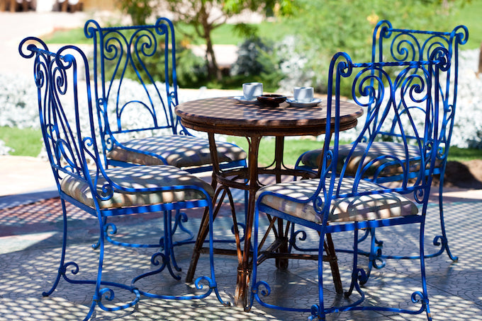 Blue wrought iron furniture table and chairs