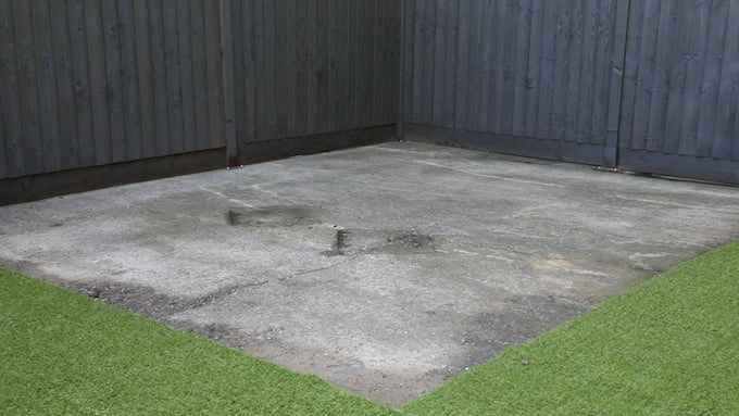 a concrete base for a metal shed