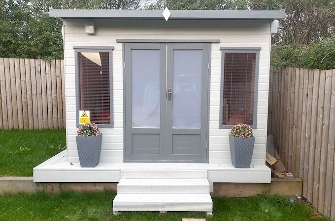 White and grey summerhouse turned beauty salon