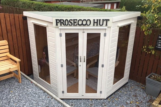 Exterior view of Waltons corner summerhouse turned prosecco hut