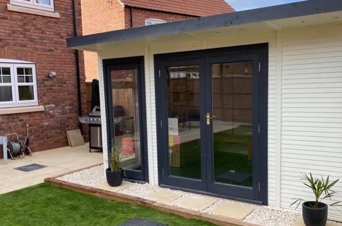 Side view of grey and cream Insulated Garden Room