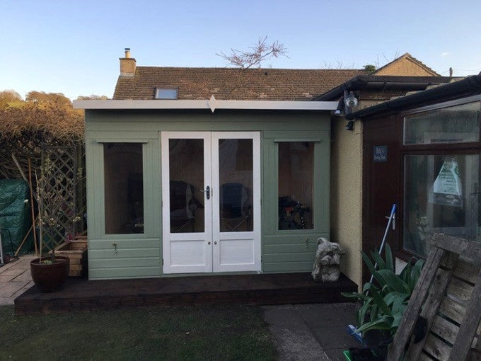 Early stages of green and white summer house