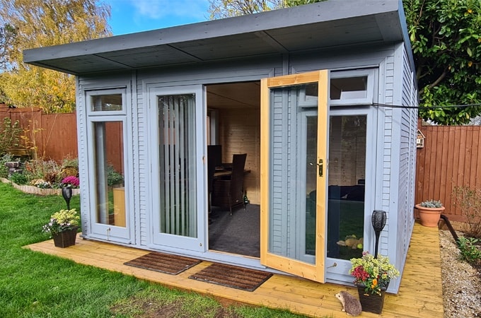 Front view of painted grey Insulated Garden Room