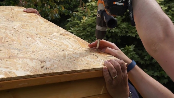 Installing roof panels for shed