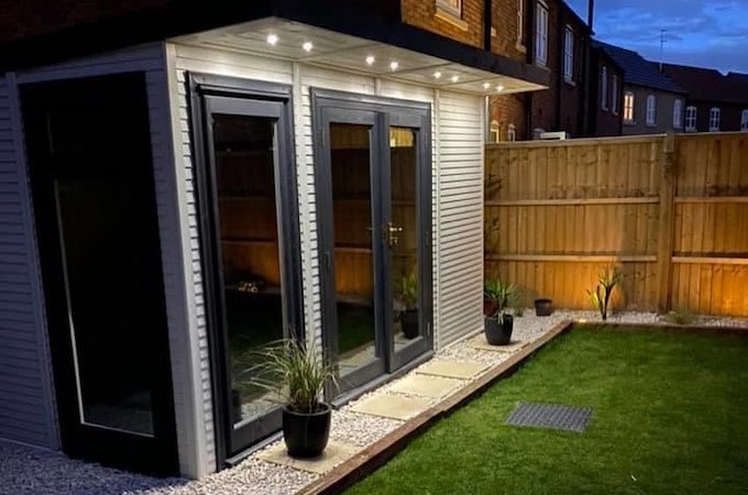 Insulated garden room with exterior in-built lights