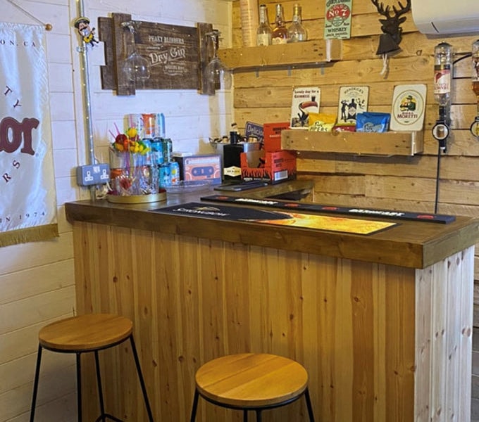 Interior of insulated garden room with corner garden bar