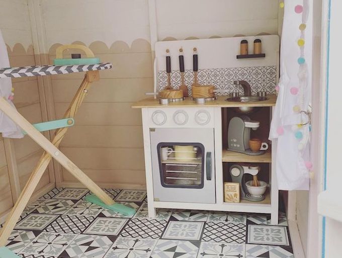 Interior of play kitchen inside a Waltons playhouse