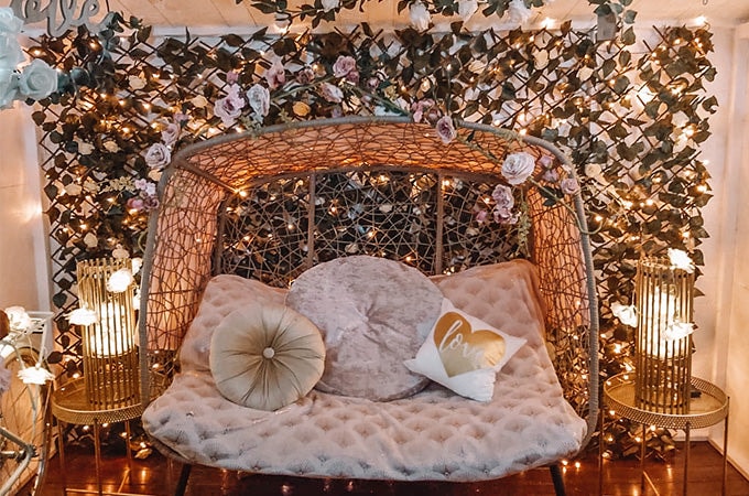 Flower wall with lights and statement chair