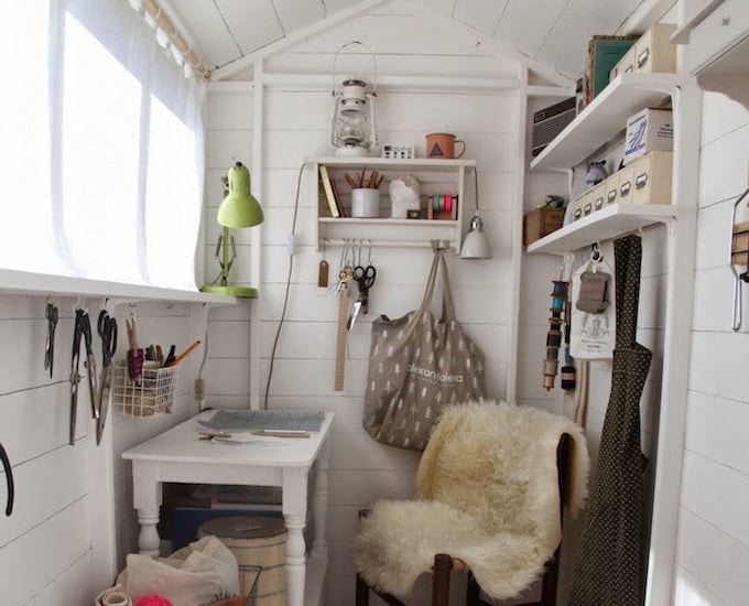 White craft room with storage