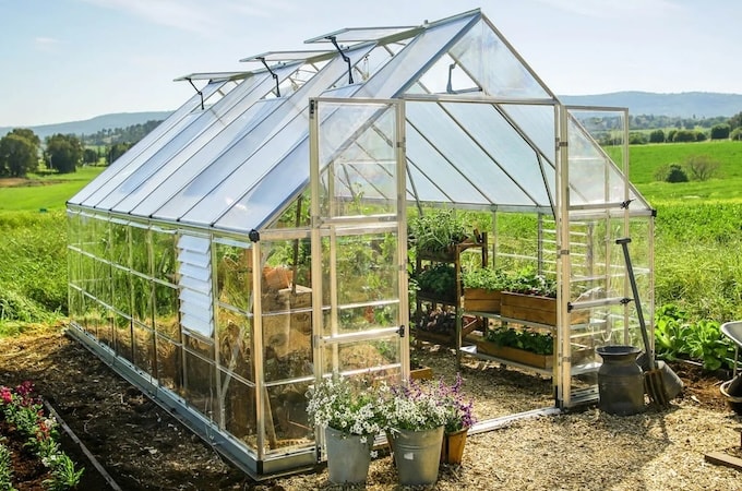 Large polycarbonate playhouse with open doors, windows and vents