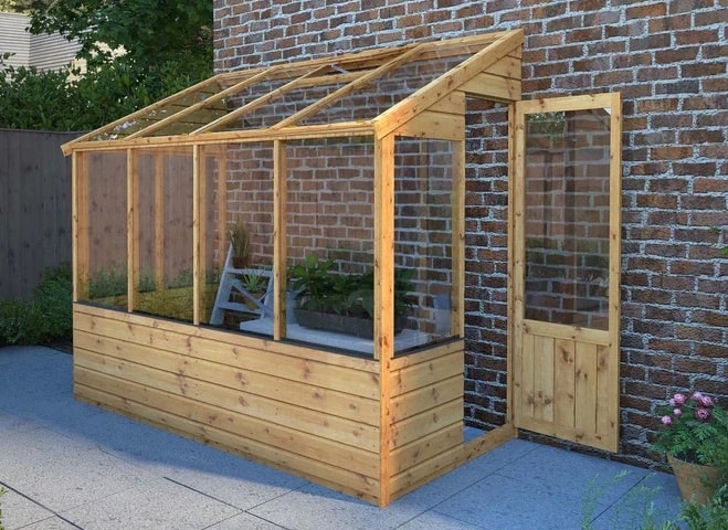 Lean to greenhouse against wall with door open