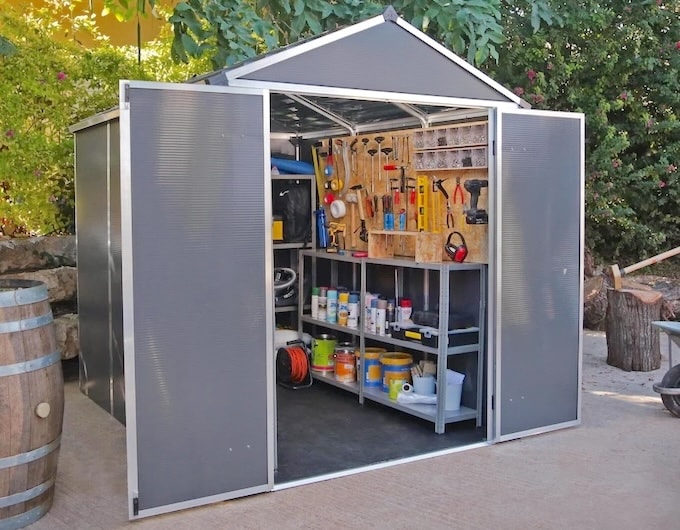 Plastic shed with double doors open showing organised interior