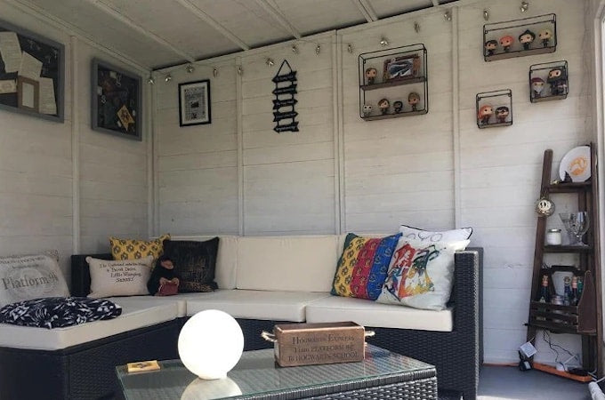 Interior of Harry Potter themed summerhouse with pop figures