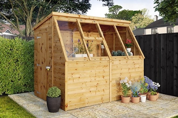 Potting shed greenhouse with paving slab base