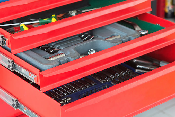Red tool box filled with tools