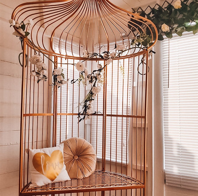 Rose gold statement chair against summer house window