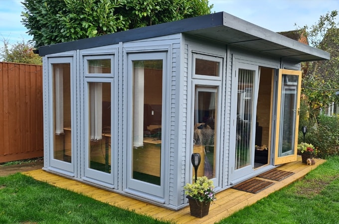 Side view of painted Waltons Insulated Garden Room 