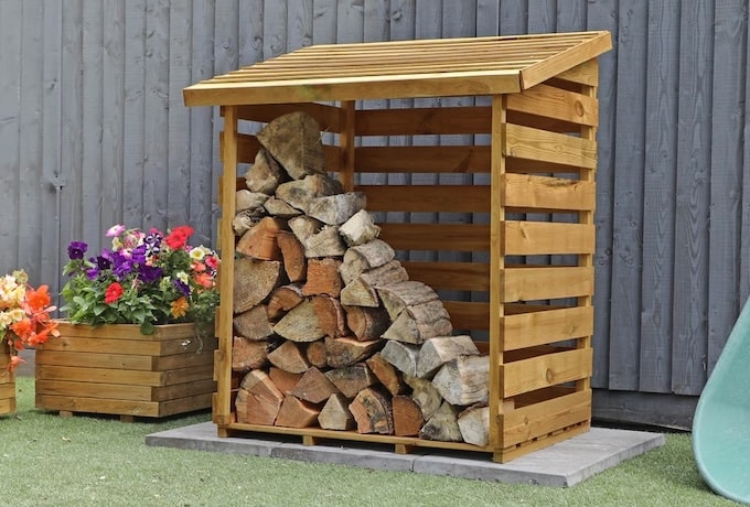 Single Waltons wooden log store with stacked up logs